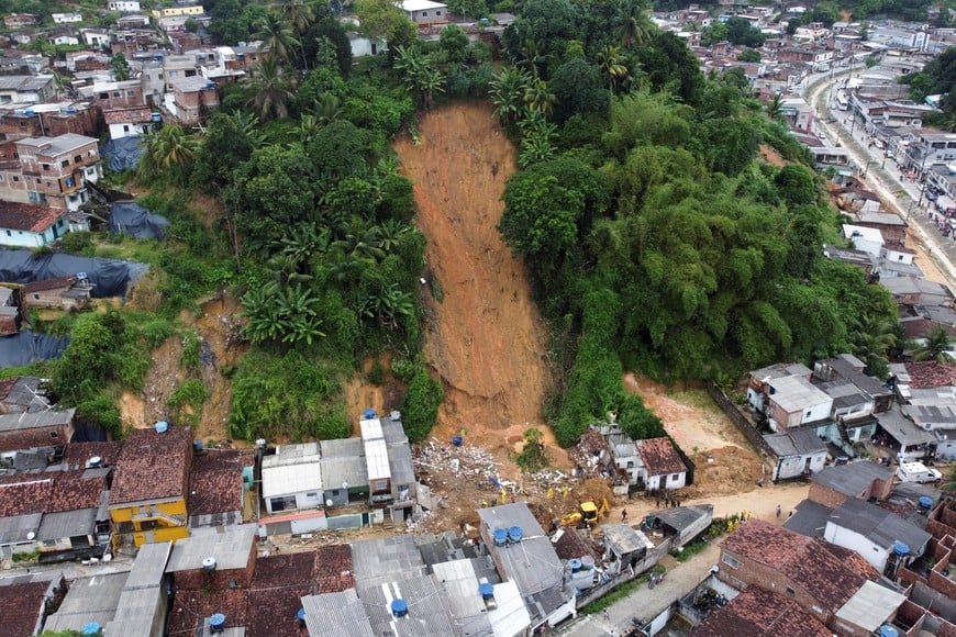 Firefighters, volunteers and army officers work on the site where a house collapsed due to a landslide caused by heavy rains at Jardim Monte Verde, in Ibura neighbourhood, in Recife, Brazil, May 29, 2022. Picture taken with a drone. REUTERS/Diego Nigro. NO RESALES. NO ARCHIVES