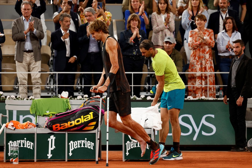 Tennis - French Open - Roland Garros, Paris, France - June 3, 2022
Germany's Alexander Zverev retires from the match after sustaining an injury as Spain's Rafael Nadal looks on REUTERS/Yves Herman