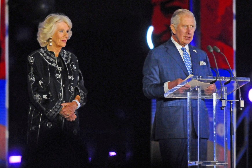 Britain's Prince Charles speaks next to Camilla, Duchess of Cornwall, during Queen Elizabeth's Platinum Jubilee concert in front of Buckingham Palace, London, Britain June 4, 2022. Picture taken June 4, 2022. Kerry Davies/Pool via REUTERS