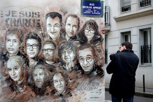 A mural by street artist Christian Guemy (a.k.a C215) is seen near the satirical newspaper Charlie Hebdo's former office, after a ceremony to mark the fourth anniversary of the attack in Paris, France, January 7, 2019. REUTERS/Gonzalo Fuentes    NO RESALES. NO ARCHIVES