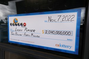 A display check is seen at Joe's Service Center, where a single winning ticket for the Powerball lottery drawing was sold, in Altadena, California, U.S., November 8, 2022. REUTERS/Mike Blake