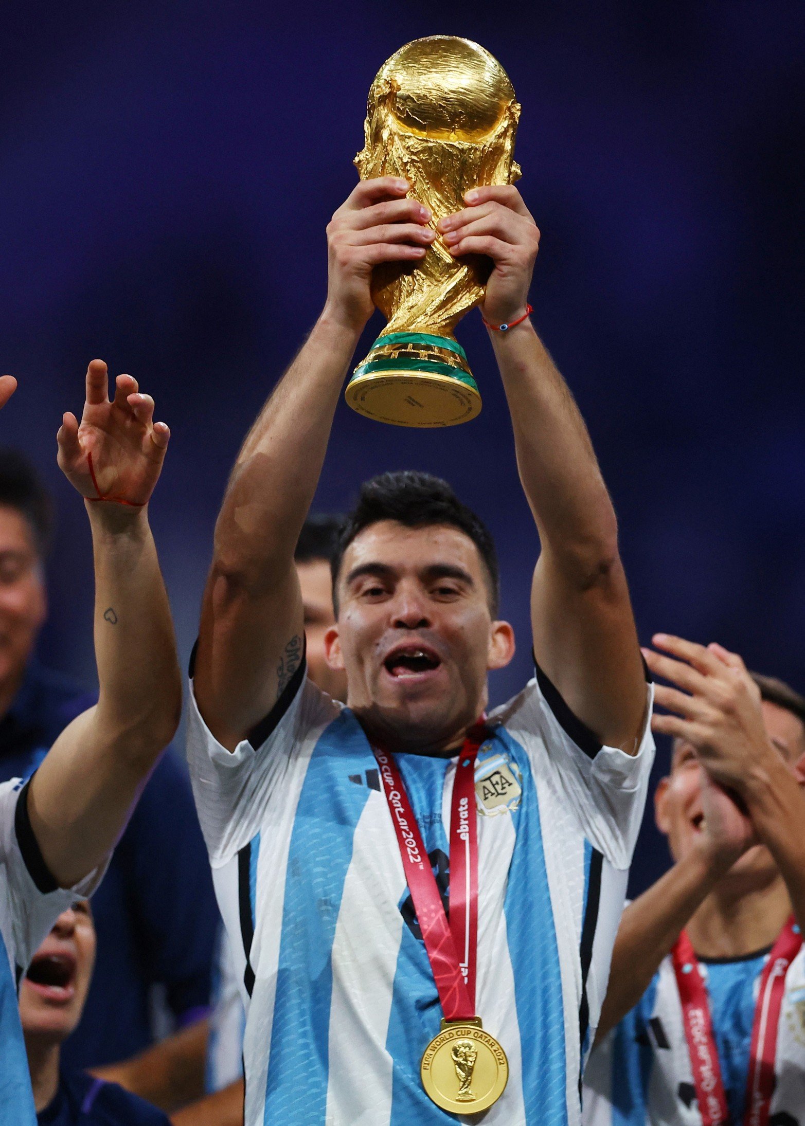 Soccer Football - FIFA World Cup Qatar 2022 - Final - Argentina v France - Lusail Stadium, Lusail, Qatar - December 18, 2022
Argentina's Marcos Acuna celebrates with the trophy after winning the World Cup REUTERS/Kai Pfaffenbach