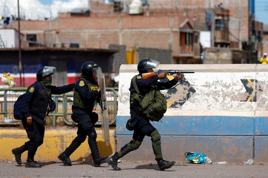 Peruvian police officers operate as demonstrators hold a protest demanding early elections and the release of Peruvian ousted leader Pedro Castillo, in Juliaca, Peru January 8, 2023. REUTERS/Hugo Courotto NO RESALES. NO ARCHIVES