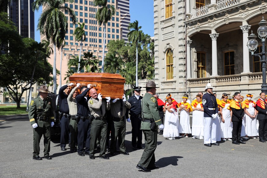 The casket of Abigail Kawananakoa, who died December 11, 2022 at the age of 96 and was considered a princess for her royal heritage, is carried into Iolani Palace where she will lie in state, in Honolulu, Hawaii, U.S. January 22, 2023. REUTERS/Marco Garcia