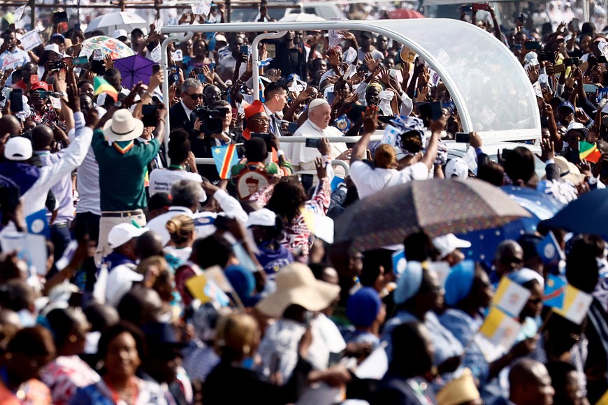 Pope Francis greets people at Ndolo Airport during his apostolic journey, in Kinshasa, Democratic Republic of the Congo, February 1, 2023. REUTERS/Yara Nardi