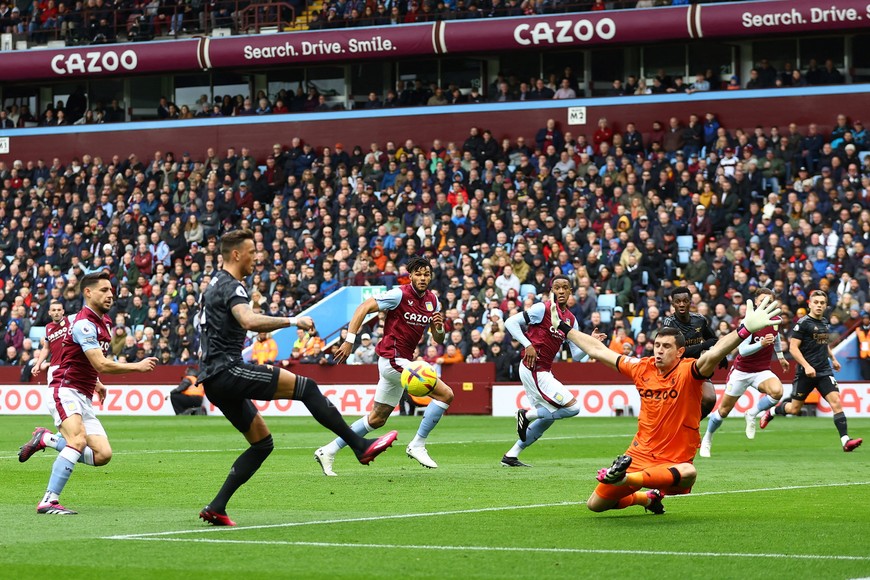 Soccer Football - Premier League - Aston Villa v Arsenal - Villa Park, Birmingham, Britain - February 18, 2023
Arsenal's Ben White in action with Aston Villa's Emiliano Martinez REUTERS/Hannah Mckay EDITORIAL USE ONLY. No use with unauthorized audio, video, data, fixture lists, club/league logos or 'live' services. Online in-match use limited to 75 images, no video emulation. No use in betting, games or single club	/league/player publications.  Please contact your account representative for further details.