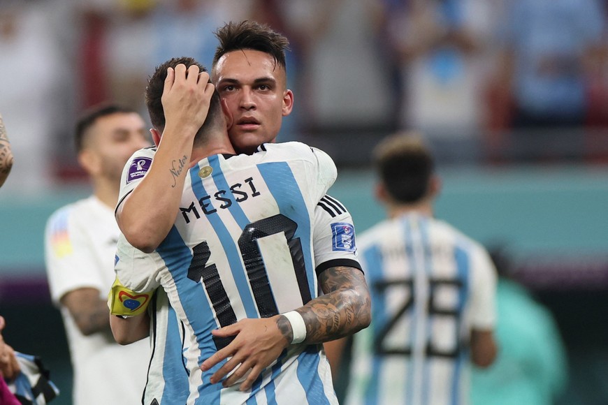 Soccer Football - FIFA World Cup Qatar 2022 - Round of 16 - Argentina v Australia - Ahmad bin Ali Stadium, Al Rayyan, Qatar - December 3, 2022
Argentina's Lionel Messi and Lautaro Martinez celebrate after the match as Argentina progress to the quarter finals REUTERS/Pedro Nunes