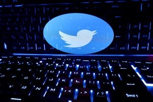 FILE PHOTO: A keyboard is placed in front of a displayed Twitter logo in this illustration taken February 21, 2023. REUTERS/Dado Ruvic/Illustration/File Photo