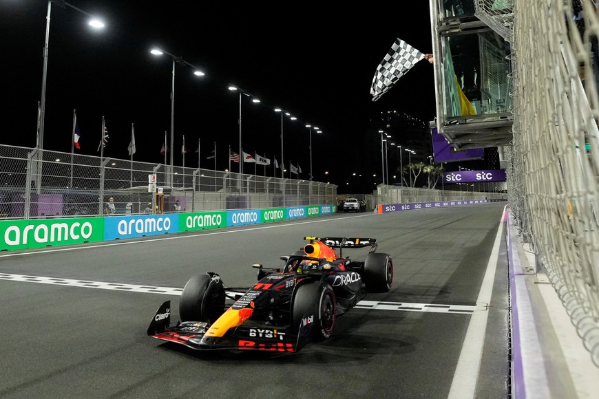 Formula One F1 - Saudi Arabian Grand Prix - Jeddah Corniche Circuit, Jeddah, Saudi Arabia - March 19, 2023
Red Bull's Sergio Perez passes the chequered flag to win the Saudi Arabian Grand Prix Pool via REUTERS/Luca Bruno