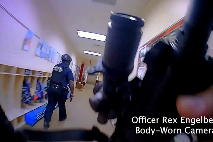 Metropolitan Nashville Police Department officers search for the mass shooting suspect in The Covenenant School, in a still image from body camera video in Nashville, Tennessee, U.S. March 27, 2023.  Metropolitan Nashville Police Department/Handout via REUTERS. 
THIS IMAGE HAS BEEN SUPPLIED BY A THIRD PARTY.
