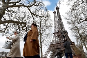 "Eiffela", a replica of the famous Parisian Tower, ten times smaller than its model and created by Philippe Maindron and is pictured near the original one in Paris, France, April 3, 2023. REUTERS/Benoit Tessier