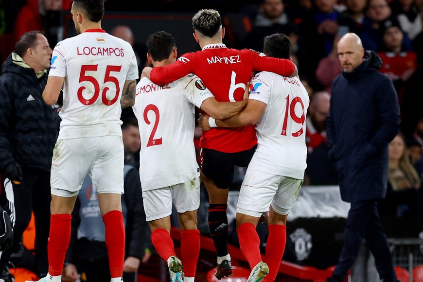 Soccer Football - Europa League - Quarter Final - First Leg - Manchester United v Sevilla - Old Trafford, Manchester, Britain - April 13, 2023 
Manchester United's Lisandro Martinez is helped off the pitch by Sevilla's Marcos Acuna and Gonzalo Montiel after sustaining an injury Action Images via Reuters/Lee Smith