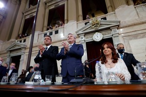 Argentina's President Alberto Fernandez and President of the Chamber of Deputies Sergio Massa gesture next to Vice President Cristina Fernandez de Kirchner at the opening session of the legislative term for 2022 at the National Congress in Buenos Aires, Argentina March 1, 2022. Juan Ignacio Roncoroni/Pool via REUTERS