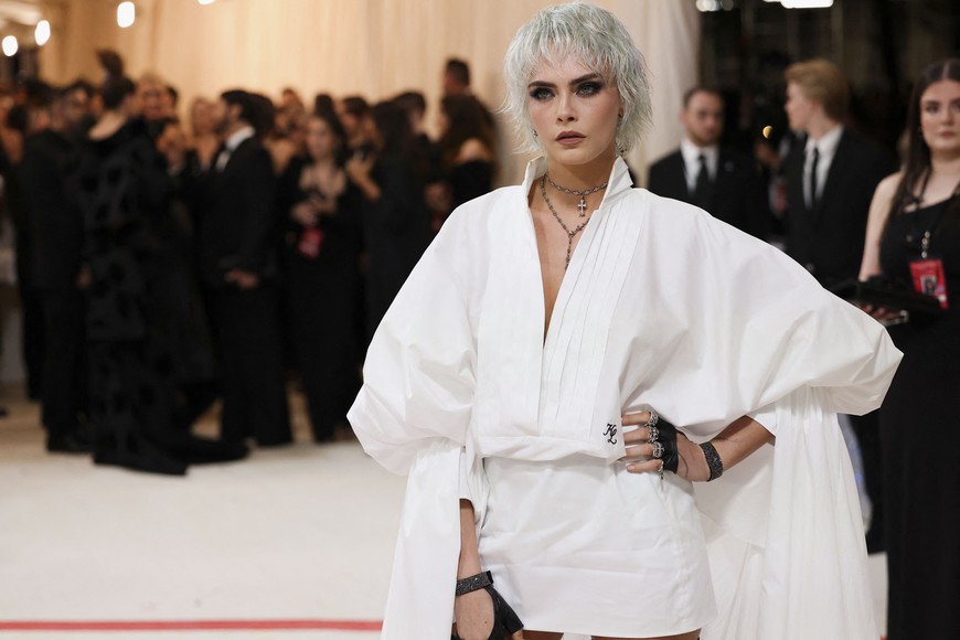 Cara Delevingne poses at the Met Gala, an annual fundraising gala held for the benefit of the Metropolitan Museum of Art's Costume Institute with this year's theme "Karl Lagerfeld: A Line of Beauty", in New York City, New York, U.S., May 1, 2023. REUTERS/Andrew Kelly