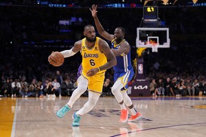 May 8, 2023; Los Angeles, California, USA; Los Angeles Lakers forward LeBron James (6) dribbles the ball against Golden State Warriors forward Andrew Wiggins (22) in the second half of game four of the 2023 NBA playoffs at Crypto.com Arena. Mandatory Credit: Kirby Lee-USA TODAY Sports