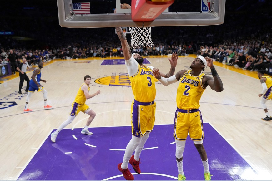 May 8, 2023; Los Angeles, California, USA; Los Angeles Lakers forward Troy Brown Jr. (7) and forward Jarred Vanderbilt (2) rebound the ball against the Golden State Warriors in the first half of game four of the 2023 NBA playoffs at Crypto.com Arena. Mandatory Credit: Kirby Lee-USA TODAY Sports