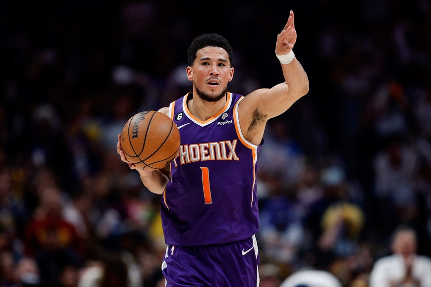 May 9, 2023; Denver, Colorado, USA; Phoenix Suns guard Devin Booker (1) controls the ball in the first quarter against the Denver Nuggets during game five of the 2023 NBA playoffs at Ball Arena. Mandatory Credit: Isaiah J. Downing-USA TODAY Sports