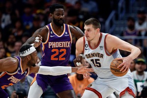 May 9, 2023; Denver, Colorado, USA; Denver Nuggets center Nikola Jokic (15) controls the ball under pressure from Phoenix Suns center Deandre Ayton (22) and forward Josh Okogie (2) in the first quarter during game five of the 2023 NBA playoffs at Ball Arena. Mandatory Credit: Isaiah J. Downing-USA TODAY Sports