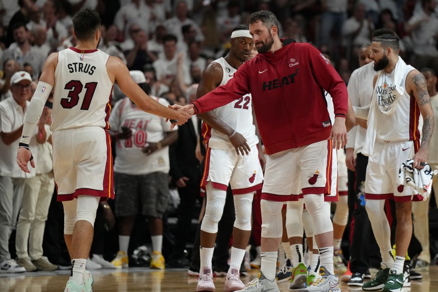 May 12, 2023; Miami, Florida, USA; Miami Heat forward Kevin Love (42) congratulates guard Max Strus (31) after the Heat rally against the New York Knicks in the second half during game six of the 2023 NBA playoffs at Kaseya Center. Mandatory Credit: Jim Rassol-USA TODAY Sports
