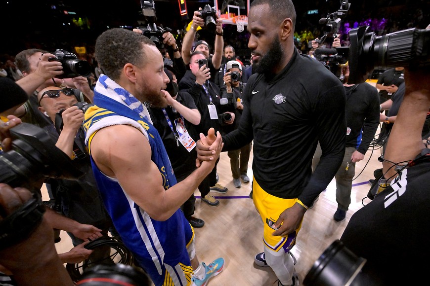 May 12, 2023; Los Angeles, California, USA; Los Angeles Lakers forward LeBron James (6) and Golden State Warriors guard Stephen Curry (30) embrace after game six of the 2023 NBA playoffs at Crypto.com Arena. Mandatory Credit: Jayne Kamin-Oncea-USA TODAY Sports