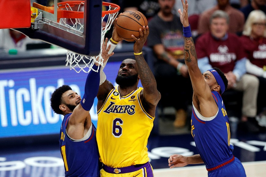 May 16, 2023; Denver, Colorado, USA; Los Angeles Lakers forward LeBron James (6) shoots against Denver Nuggets guard Jamal Murray (27) and forward Bruce Brown (11) in the third quarter during game one of the Western Conference Finals for the 2023 NBA playoffs at Ball Arena. Mandatory Credit: Isaiah J. Downing-USA TODAY Sports