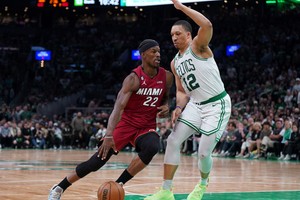May 19, 2023; Boston, Massachusetts, USA; Miami Heat forward Jimmy Butler (22) dribbles against Boston Celtics forward Grant Williams (12) during the second half of game two of the Eastern Conference Finals for the 2023 NBA playoffs at TD Garden. Mandatory Credit: David Butler II-USA TODAY Sports