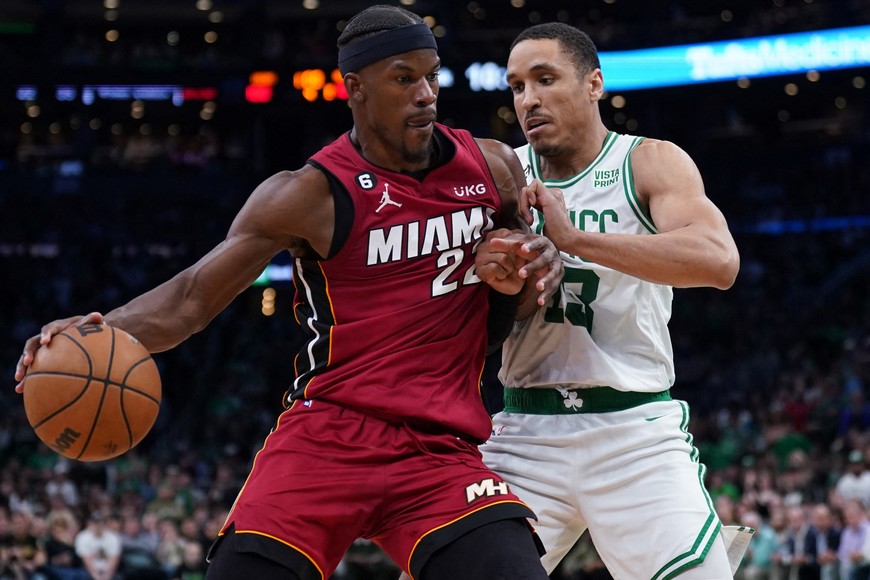 May 19, 2023; Boston, Massachusetts, USA; Miami Heat forward Jimmy Butler (22) drives into Boston Celtics guard Malcolm Brogdon (13) during the second half of game two of the Eastern Conference Finals for the 2023 NBA playoffs at TD Garden. Mandatory Credit: David Butler II-USA TODAY Sports