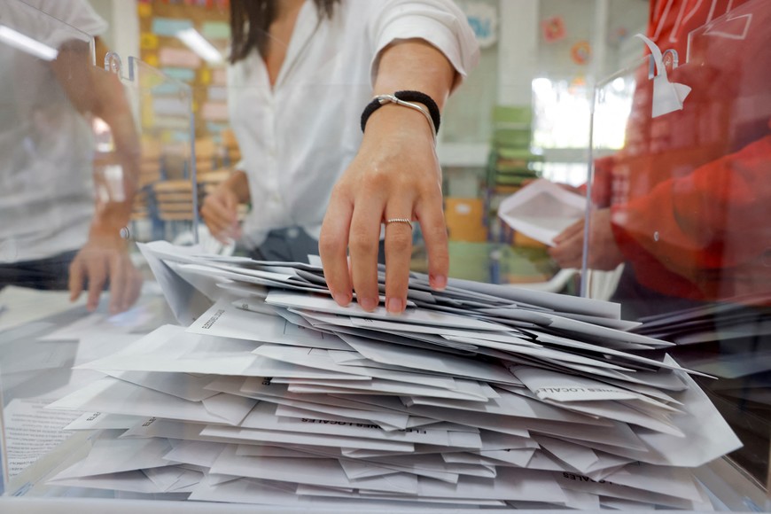 Members of an electoral table count the ballots of the local elections, in Ronda, southern Spain, May 28, 2023. REUTERS/Jon Nazca