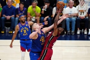 Jun 1, 2023; Denver, CO, USA; Miami Heat center Bam Adebayo (13) and Denver Nuggets center Nikola Jokic (15) battle for the ball during the fourth quarter in game one of the 2023 NBA Finals at Ball Arena. Mandatory Credit: Ron Chenoy-USA TODAY Sports