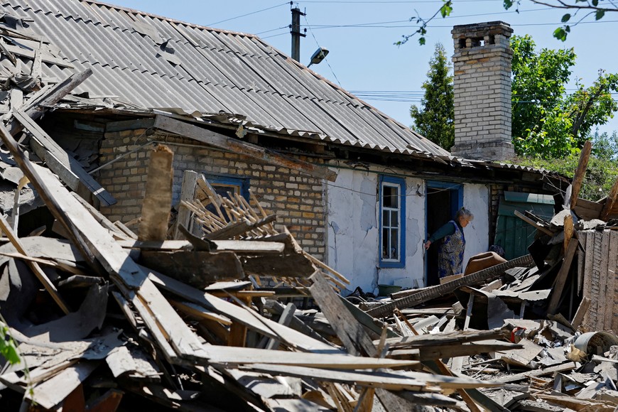 Local resident Lilia Tabala, 75, stands near the ruins of her garage and summer kitchen, destroyed by recent shelling in the course of Russia-Ukraine conflict, in the town of Horlivka (Gorlovka) in the Donetsk region, Russian-controlled Ukraine, June 5, 2023. REUTERS/Alexander Ermochenko