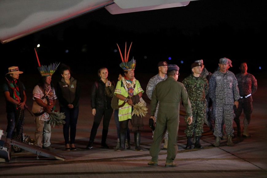 Members of the indigenous Taita community stand at CATAM military airbase on the day the child survivors of a Cessna 206 plane that crashed in thick jungle were brought in by plane from San Jose del Guaviare, in Bogota, Colombia, June 10, 2023. REUTERS/Luisa Gonzalez