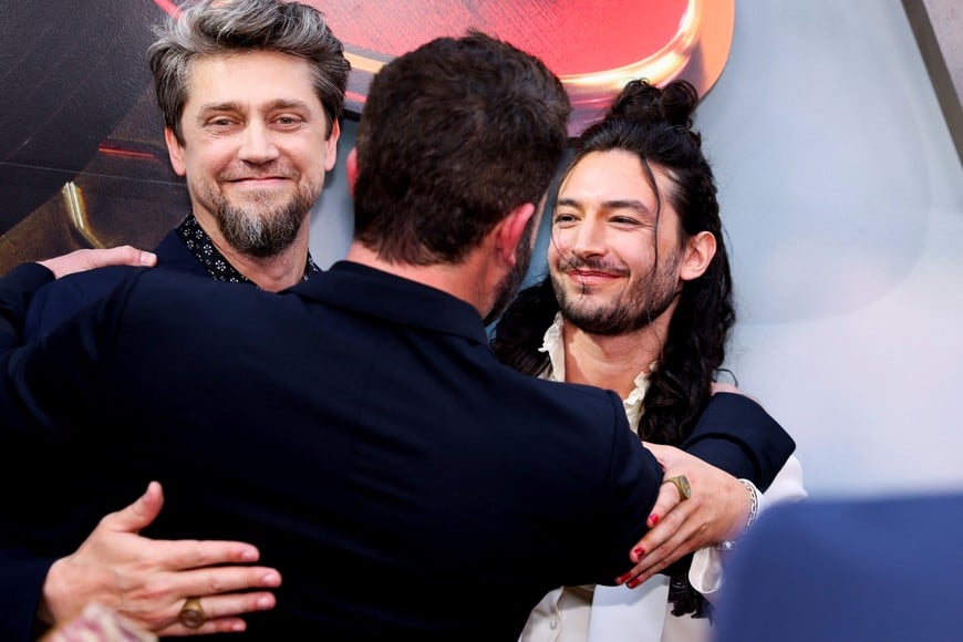 Ezra Miller, Ben Affleck and Andres Muschietti embrace during the world premiere of "The Flash", in Hollywood, Los Angeles, California, U.S., June 12, 2023.  REUTERS/Mike Blake