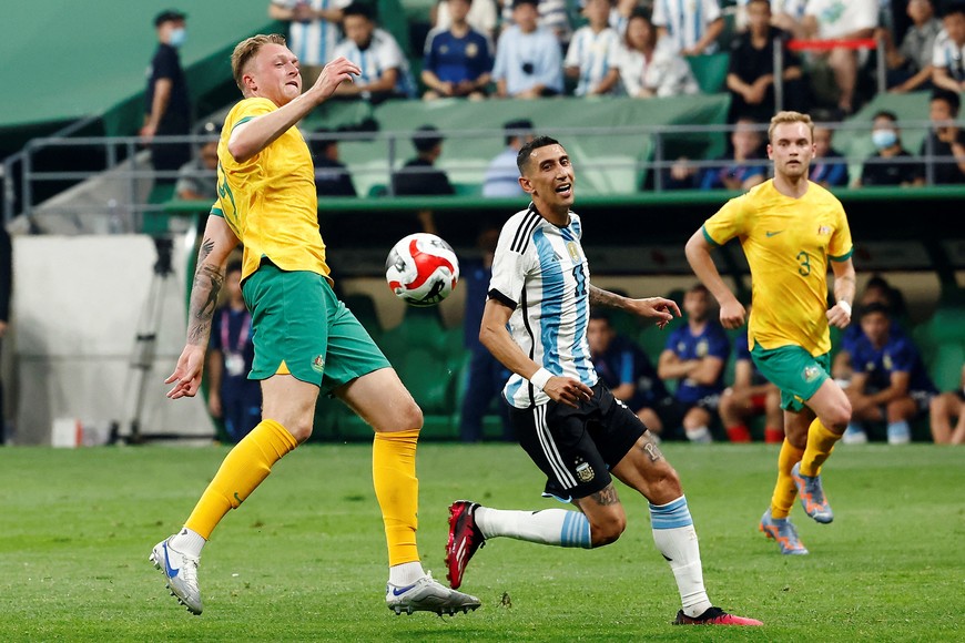 Soccer Football - Friendly - Argentina v Australia - Workers' Stadium, Beijing, China - June 15, 2023
Argentina's Angel Di Maria in action with Australia's Harry Souttar REUTERS/Thomas Peter