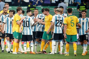 Soccer Football - Friendly - Argentina v Australia - Workers' Stadium, Beijing, China - June 15, 2023
Argentina's Lionel Messi and teammates shake hands with Australia's Ryan Strain and teammates after winning the match REUTERS/Thomas Peter