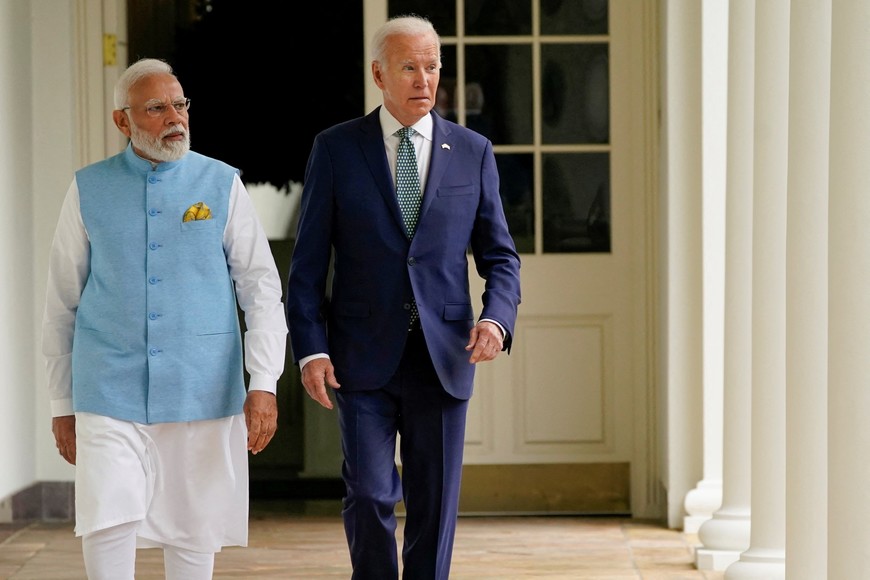 U.S. President Joe Biden and India's Prime Minister Narendra Modi walk along the Colonnade to the Oval Office after a State Arrival Ceremony on the South Lawn of the White House, Washington, U.S, June 22, 2023. Evan Vucci/Pool via REUTERS