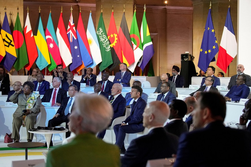 French President Emmanuel Macron, center, and other leaders attend the closing session of the New Global Financial Pact Summit, Friday, June 23, 2023 in Paris, France. The aim of the two-day climate and finance summit was to set up concrete measures to help poor and developing countries whose predicaments have been worsened by the devastating effects of the COVID-19 pandemic and the war in Ukraine better tackle poverty and climate change.     Lewis Joly/Pool via REUTERS