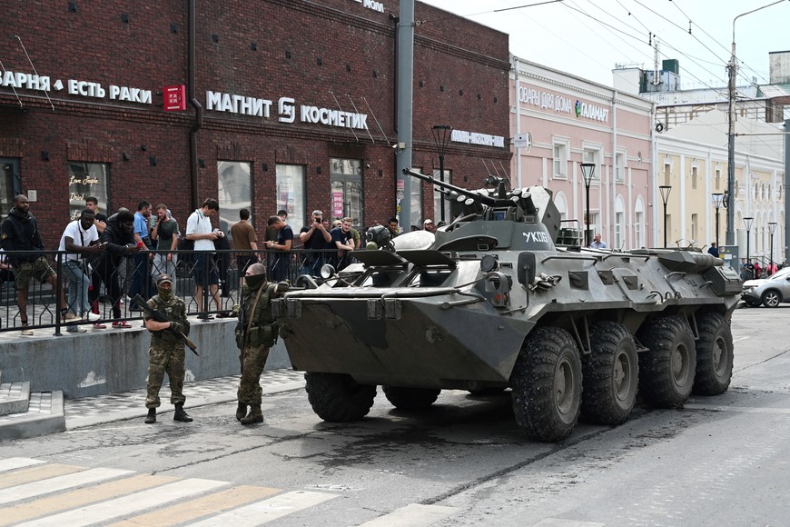 Fighters of Wagner private mercenary group stand next to an armoured vehicle in a street in the city of Rostov-on-Don, Russia, June 24, 2023. REUTERS/Stringer