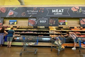 FILE PHOTO: Shoppers browse at the meat section at a Walmart Superstore during the outbreak of the coronavirus disease (COVID-19), in Rosemead, California, U.S., June 11, 2020.  REUTERS/Mario Anzuoni/File Photo