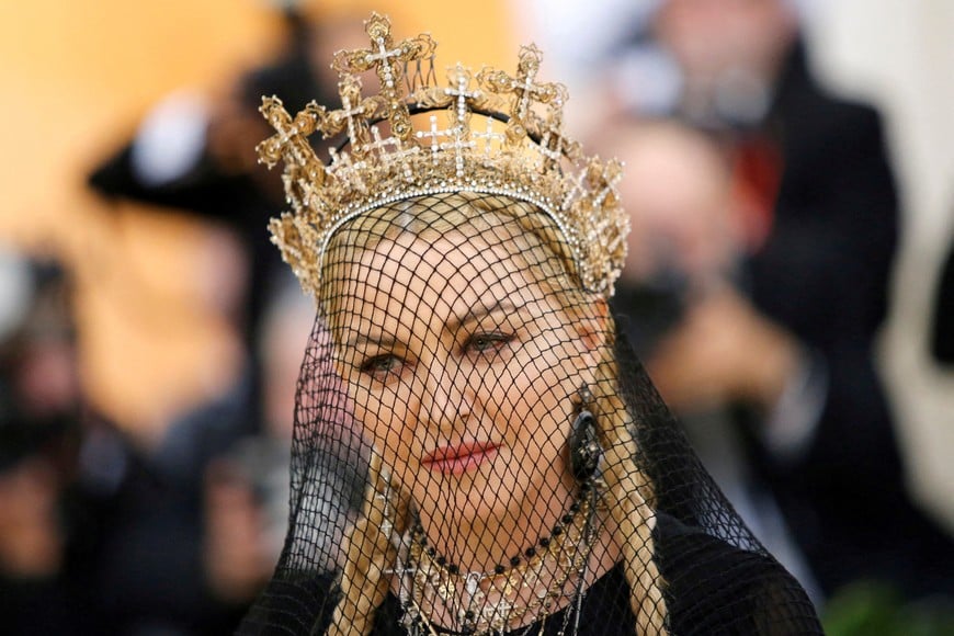 FILE PHOTO: Madonna arrives at the Metropolitan Museum of Art Costume Institute Gala (Met Gala) to celebrate the opening of “Heavenly Bodies: Fashion and the Catholic Imagination” in the Manhattan borough of New York, U.S., May 7, 2018. REUTERS/Eduardo Munoz/File Photo