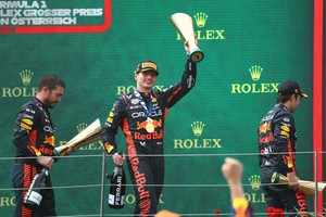 Formula One F1 - Austrian Grand Prix - Red Bull Ring, Spielberg, Austria - July 2, 2023
Red Bull's Max Verstappen celebrates with a trophy on the podium after winning the race alongside third placed Red Bull's Sergio Perez REUTERS/Bernadett Szabo