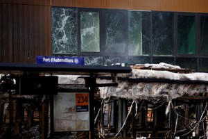 FILE PHOTO: View of damaged windows of the building site of the Paris 2024 Olympics' aquatic training centre near a RATP bus depot damaged during clashes between protesters and police, following the death of Nahel, a 17-year-old teenager killed by a French police officer in Nanterre during a traffic stop, in Aubervilliers, near Paris, France, June 30, 2023. REUTERS/Sarah Meyssonnier/File Photo