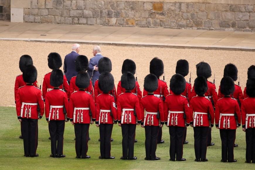 U.S. President Joe Biden and Britain's King Charles turn having inspected the Guard of Honour formed by the Welsh Guards, during a ceremonial welcome in the Quadrangle at Windsor Castle in Windsor on July 10, 2023.  Sgt Donald C Todd/Handout via REUTERS    THIS IMAGE HAS BEEN SUPPLIED BY A THIRD PARTY.