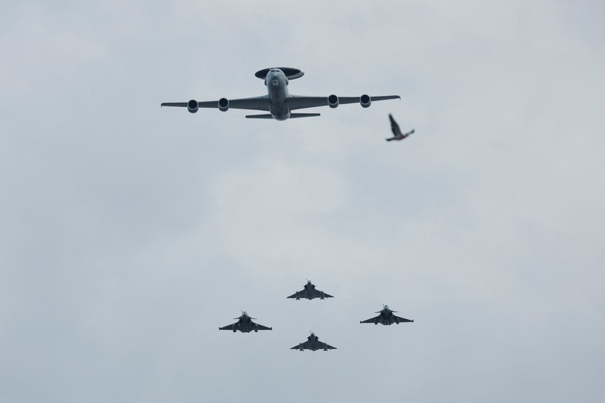 A Boeing AWACS plane, Mirage-2000 and Rafale fighter jets fly during the annual Bastille Day military parade in Paris, France, July 14, 2023. REUTERS/Gonzalo Fuentes