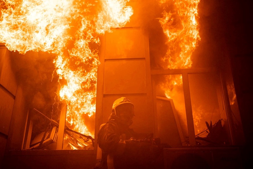 A firefighter works at a site of an administrative building heavily damaged by a Russian missile strike, amid Russia's attack on Ukraine, in Odesa, Ukraine July 20, 2023. Press service of the State Emergency Service of Ukraine/Handout via REUTERS ATTENTION EDITORS - THIS IMAGE HAS BEEN SUPPLIED BY A THIRD PARTY.     TPX IMAGES OF THE DAY