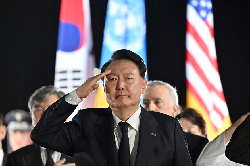 South Korean President Yoon Suk Yeol salutes during a repatriation ceremony to receive the remains of South Korean soldiers killed in the 1950-53 Korean War, a day before the 70th anniversary of the Korean armistice, at Seoul Air Base in Seongnam, South Korea July 26, 2023. Jung Yeon-je/Pool via REUTERS