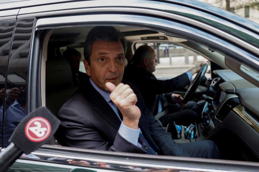 FILE PHOTO: Argentina's Economy Minister Sergio Massa talks to reporters as he departs after attending a meeting with International Monetary Fund (IMF) Chairperson and Managing Director Kristalina Georgieva at the IMF headquarters in Washington, U.S., September 12, 2022. REUTERS/Evelyn Hockastein/File Photo