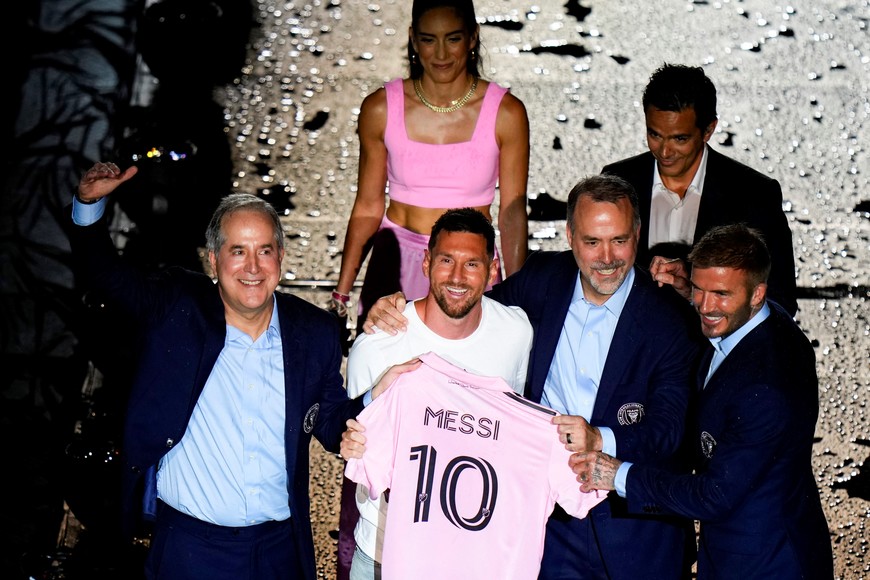 Jul 16, 2023; Ft. Lauderdale, FL, USA; Inter Miami CF forward Lionel Messi is introduced at The Unveil event and press conference on stage with Inter Miami CF managing owner Jorge Mas, Inter Miami CF co-owner Jose Mas, and Inter Miami CF co-owner David Beckham at DRV PNK Stadium. Mandatory Credit: Rich Storry-USA TODAY Sports