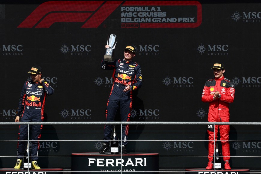 Formula One F1 - Belgian Grand Prix - Spa-Francorchamps, Spa, Belgium - July 30, 2023
Red Bull's Max Verstappen celebrates with a trophy on the podium after winning the race alongside second placed Red Bull's Sergio Perez and third placed Ferrari's Charles Leclerc REUTERS/Stephanie Lecocq