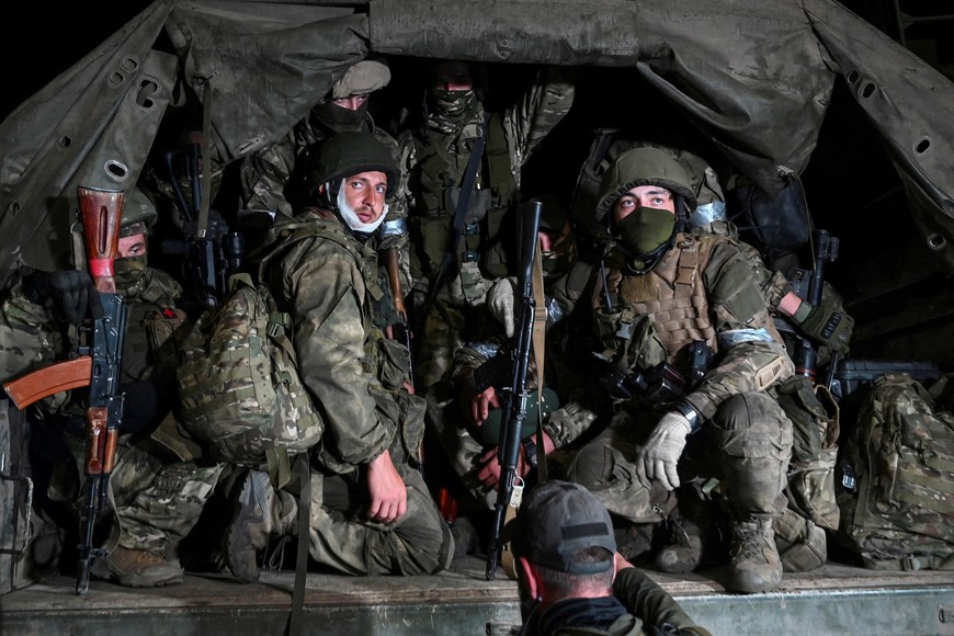 FILE PHOTO: Fighters of Wagner private mercenary group, including Roman Yamalutdinov (L), pull out of the headquarters of the Southern Military District to return to base, in the city of Rostov-on-Don, Russia, June 24, 2023. REUTERS/Stringer/File Photo