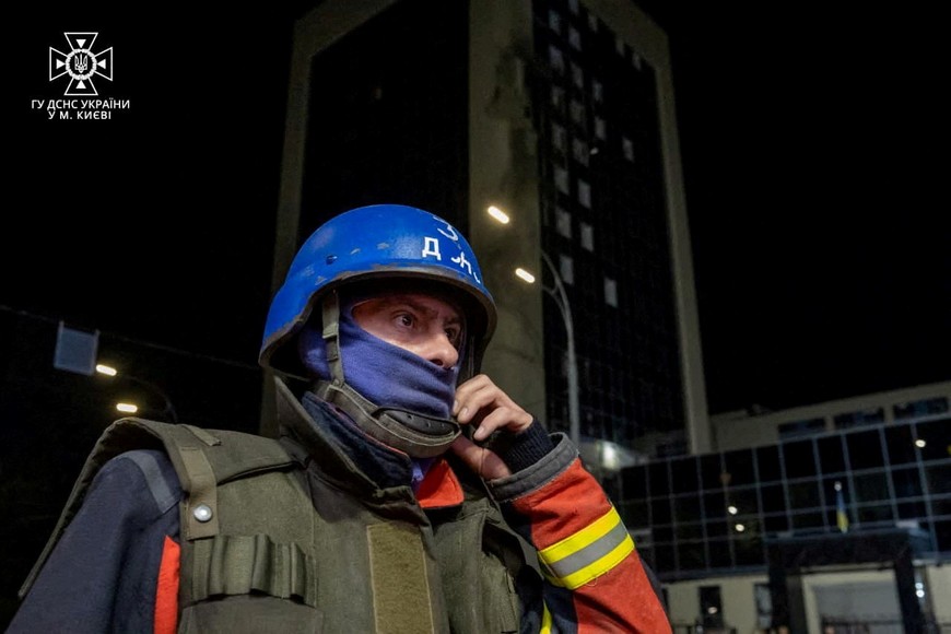 A rescue worker is seen near a damaged building, following a Russian drone attack, amid Russia's attack on Ukraine, in Kyiv, Ukraine, in this handout image released on August 2, 2023. State Emergency Service of Ukraine/Handout via REUTERS THIS IMAGE HAS BEEN SUPPLIED BY A THIRD PARTY. MANDATORY CREDIT. DO NOT OBSCURE LOGO.